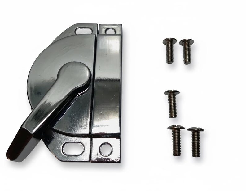 May include: A polished chrome window sash lock featuring a semi-circular base with a rotating lever handle and a rectangular mounting plate with two screw holes. The set includes five small metal screws with flat heads for installation purposes.