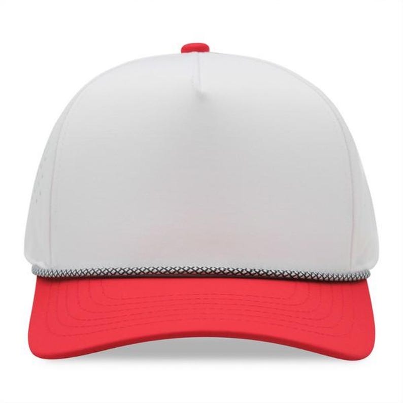 May include: A white trucker hat with a red brim and a red button on top. The hat has a black and white rope detail along the brim. The hat is a classic style.