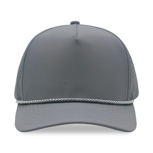 May include: A gray baseball cap with a curved brim and a white and gray rope detail. The cap has a perforated mesh panel on the side for ventilation. The cap is a solid gray color.