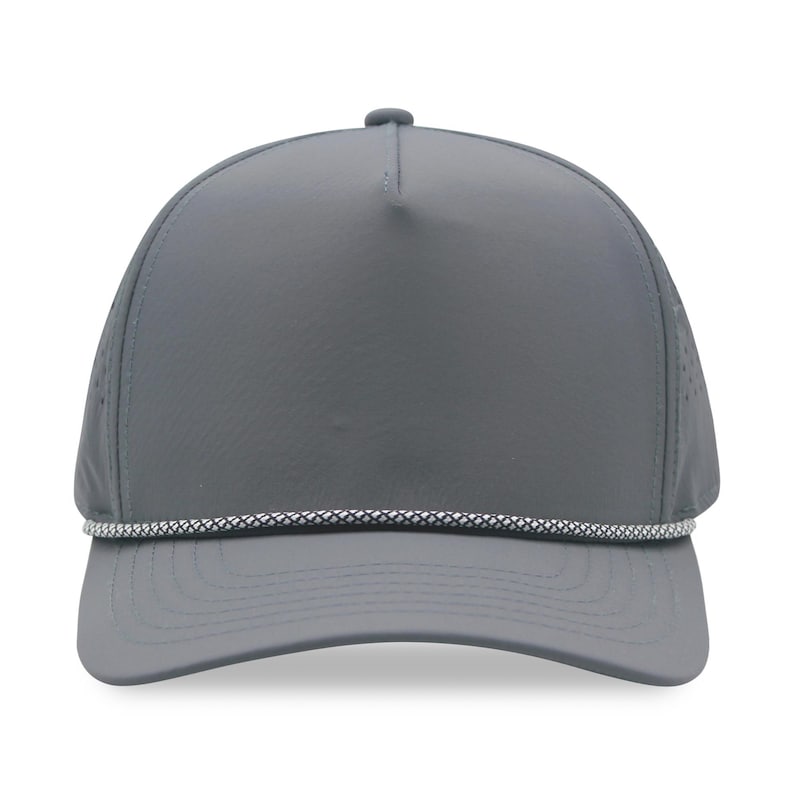 May include: A gray baseball cap with a curved brim and a white and gray rope detail. The cap has a perforated mesh panel on the side for ventilation. The cap is a solid gray color.
