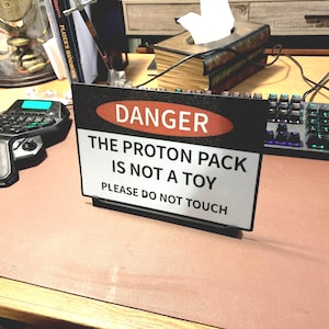 proton pack sign and stand