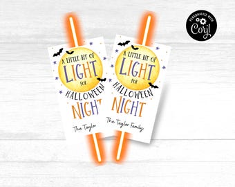 May include: Two Halloween-themed gift tags with the text "A Little Bit of Light for Halloween Night." The tags feature a yellow moon, bats, and stars. The bottom of the tags read "The Taylor Family."