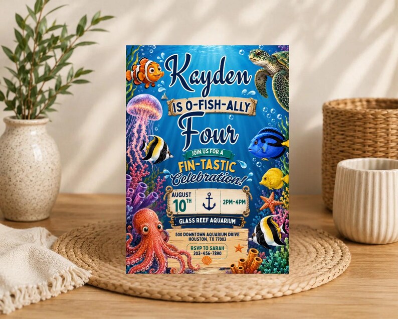 May include: A rectangular birthday invitation card featuring a vibrant underwater scene with a clownfish, sea turtle, jellyfish, octopus, and various tropical fish. The text reads Kayden is O-Fish-Ally Four, Join us for a Fin-Tastic Celebration.