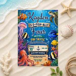 May include: A rectangular invitation card with a blue underwater theme featuring a clownfish, sea turtle, jellyfish, octopus, and tropical fish. The text reads: Kayden is O-Fish-Ally Four, Join us for a Fin-Tastic Celebration, August 10th, 2pm-4pm, Glass Reef Aquarium, 500 Downtown Aquarium Drive, Houston, TX 77002, RSVP to Sarah 203-456-7890.