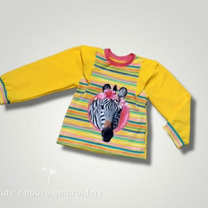 Zebrabluse mit Flügeln und weiten Ärmeln