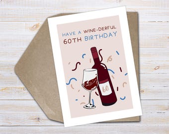 May include: A greeting card with a wine theme for a 60th birthday. The card features a wine bottle, a glass of wine, and the text "Have a Wine-derful 60th Birthday" in blue and red. The card is on a brown envelope.