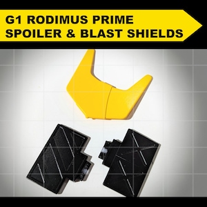 May include: G1 Rodimus Prime Spoiler & Blast Shields. A yellow plastic spoiler and two black plastic blast shields.