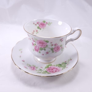 Avon Pink Roses Tea Cup and Saucer Fine Bone China Made In England 1974