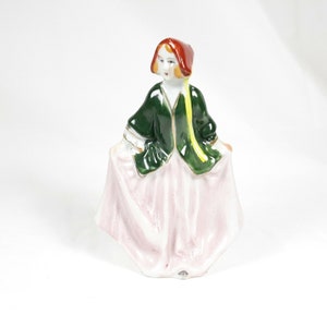Made In Occupied Japan Girl Dancing Bowing Green Coat Pink Dress Figurine