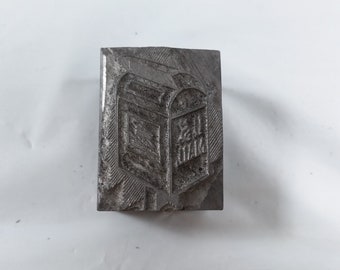 May include: A metal stamp with a design of a mailbox with the words "Mail Box" on it.