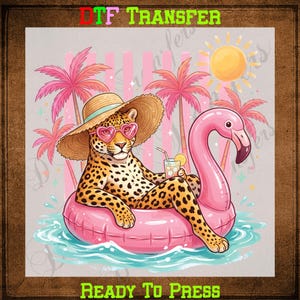 May include: A leopard wearing a straw hat and heart-shaped sunglasses, relaxing on a pink flamingo float in the water. The image includes palm trees, a sun, and the text "DTF TRANSFER" and "READY TO PRESS".