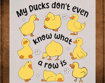 May include: A DTF transfer design featuring cartoon yellow ducks in various poses. The text "My Ducks don't even know what a row is" is displayed above and below the ducks. The words "DTF TRANSFER" and "READY TO PRESS" are also visible.