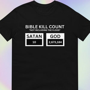 May include: Black t-shirt with white text that reads "Bible Kill Count *Not Including The Flood*" with two boxes, one labeled "Satan" with the number "10" inside and the other labeled "God" with the number "2,673,184" inside.