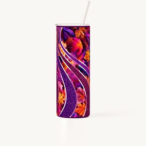 May include: A purple and silver tumbler with a fall leaf design. The leaves are in shades of orange, red, and yellow. The tumbler has a straw.