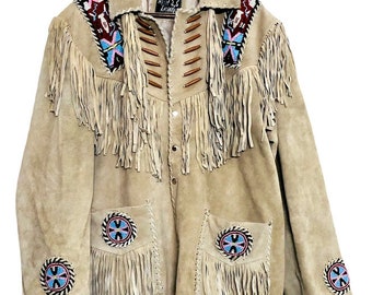 May include: Beige suede jacket with fringe detailing and colorful beaded accents. The jacket features fringe along the sleeves, pockets, and front. The collar and shoulders are adorned with intricate beadwork in shades of red, blue, and white.