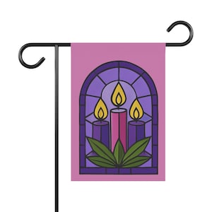 May include: A rectangular garden flag featuring a pink background and a central stained glass window illustration. The design displays three lit candles in shades of purple and pink, surrounded by green leaves, all framed by a dark arched border.