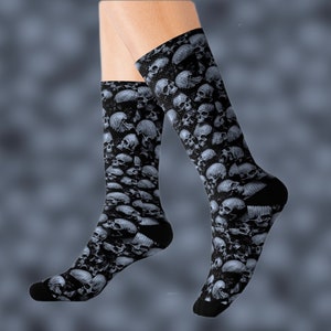 May include: A pair of black socks with a skull pattern. The socks are made of a soft, comfortable material and are perfect for everyday wear.