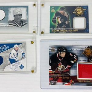 Tarjetas raras de camisetas de hockey usadas en juegos: Mario LEMIEUX, Jaromir JAGR, Mats SUNDIN y Alexei Yashin (4 en total)