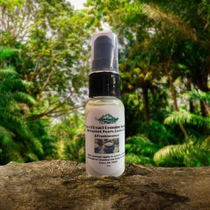 May include: A small, clear bottle with a black cap and white label. The label reads "The Of Pearl Genuine Serum w/Crushed Pearls, Castor Oil & Frankincence".