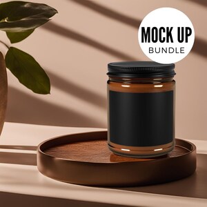 May include: A brown glass candle jar with a black lid and a black label. The candle jar is sitting on a brown wooden tray. The text "MOCK UP BUNDLE" is visible in a white circle.