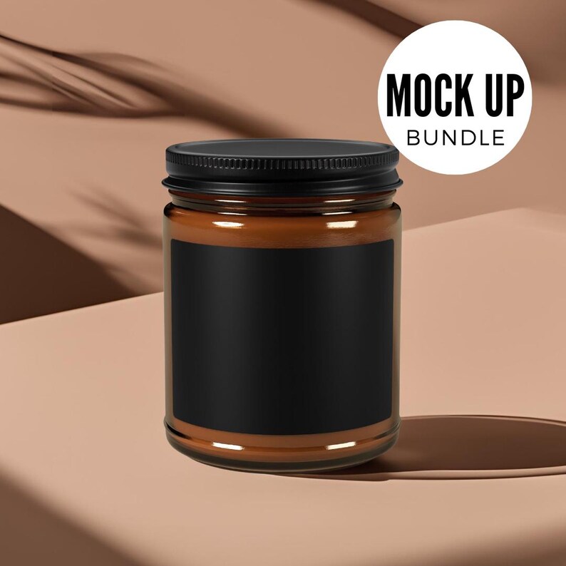 May include: A brown glass candle jar with a black lid and a black label. The jar is sitting on a light brown surface.