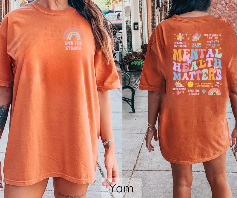May include: Orange t-shirt with a rainbow and the text "End the Stigma" on the front and a colorful graphic with the text "Mental Health Matters" on the back.