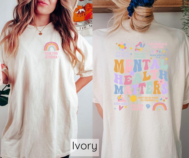 May include: Ivory t-shirt with a rainbow and the text "End the Stigma" on the front and a colorful graphic with the text "Mental Health Matters" on the back.