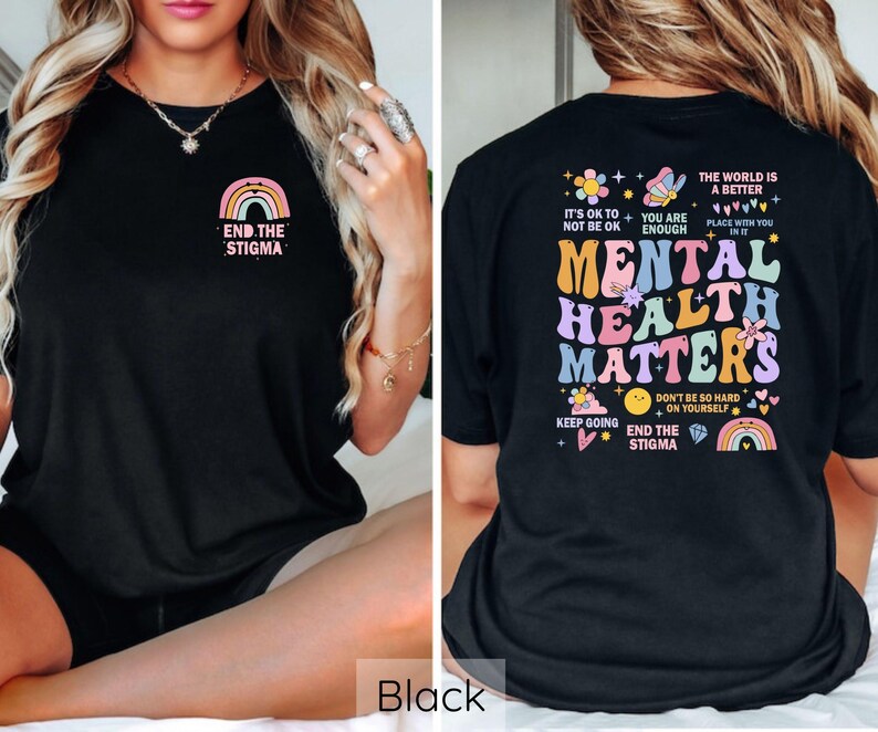 May include: Black t-shirt with a rainbow and the text "End the Stigma" on the front and a colorful graphic with the text "Mental Health Matters" on the back.