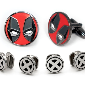 May include: A set of cufflinks featuring a red and black Deadpool logo and a silver cufflink with a black X logo.
