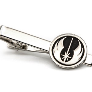 May include: A silver tie clip featuring a black and silver Rebel Alliance symbol.