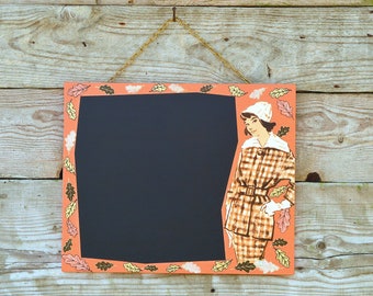 Writing board/chalkboard in orange, with original collage on the edge. Autumn motif, original vintage fashion motif 1950s. Unique piece. Wall decoration.