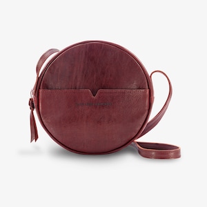 Round maroon leather HAPPY PILL crossbody, zipped leather handbag, long adjustable strap