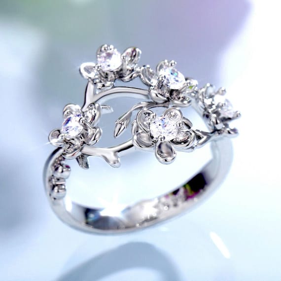 Plum Blossom Engagement Ring With Radiant Diamond