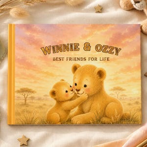May include: A rectangular hardcover book with a sunset illustration of two lion cubs on the cover. The text reads WINNIE & OZZY BEST FRIENDS FOR LIFE. The cover features a warm orange and yellow sky over a grassy savanna landscape with trees.