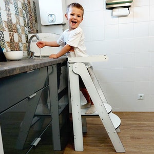 Child using learning tower