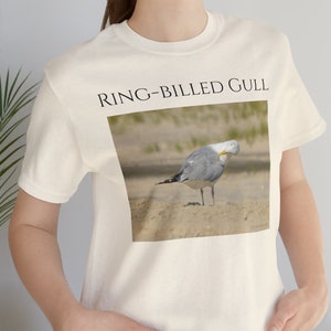 Seagull On Beach Looking Back at Camera Unisex Jersey Short Sleeve Tee