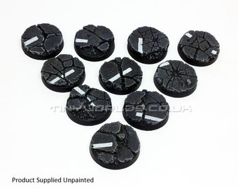 May include: A collection of ten unpainted, circular miniature bases. Each base features a cracked asphalt texture with a white painted road marking. The bases are arranged in a semi-circle against a white background. Text at the bottom reads "Product Supplied Unpainted".