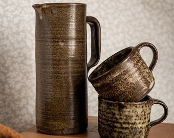 Set of 70's ceramic carafe and two vintage coffee mugs