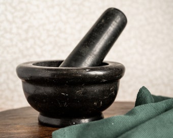 Black marble mortar with pestle