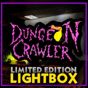 May include: A black and pink "Dungeon Crawler" lightbox with the words "Limited Edition" and "Lightbox" in yellow. The text is outlined in pink and set against a black background. The lightbox has a purple border.