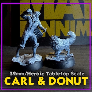 May include: Two gray miniature figurines, one of a person wielding a weapon and the other of a fluffy dog. The figures are on black bases. Text at the bottom reads "32mm/Heroic Tabletop Scale" and "CARL & DONUT".
