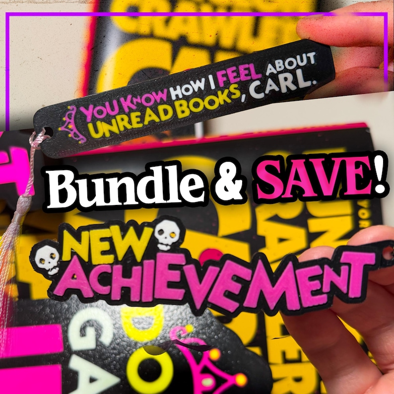 May include: Two black rectangular bookmarks with pink and yellow text. One bookmark reads, "YOU KNOW HOW I FEEL ABOUT UNREAD BOOKS, CARL." The other bookmark features two white skull icons and the text, "NEW ACHIEVEMENT" in bold pink lettering.