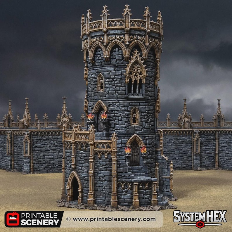May include: A miniature stone tower and wall section featuring dark grey masonry with tan gothic-style architectural trim. The structure includes arched windows, doorways, and small decorative torches with orange flames. Text reads PRINTABLE SCENERY and SYSTEM HEX.