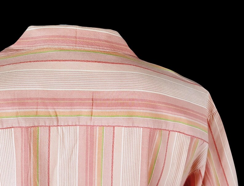 May include: A pink and white striped long-sleeve shirt with thin green stripes.