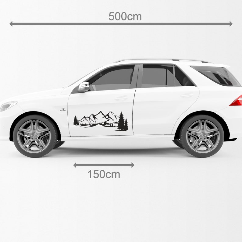 May include: A black mountain and forest decal on a white SUV. The decal is 150cm long and the car is 500cm long. The design features a mountain range, trees, and a small cabin.
