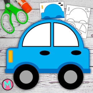May include: A bright blue paper car craft with black wheels and white windows. The image includes a pair of green scissors, a glue stick, and car templates. The car has a yellow headlight and black details. The craft is on a light wood grain surface.
