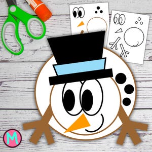 May include: A snowman craft kit with a large white circle base, black top hat, and brown stick arms. The kit includes paper cutouts for eyes, a carrot nose, and a smiling mouth. Green scissors and orange glue are in the background.