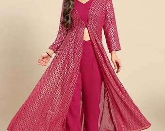 May include: A magenta three-piece outfit comprising a V-neck top, trousers, and a long, open-front jacket. The jacket features a gold geometric pattern and sheer fabric. The outfit is designed for a stylish, coordinated look.