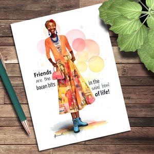 May include: A watercolor illustration on a white card features a stylish person in a colorful outfit. The person wears an orange cardigan, a patterned skirt, and blue boots. Text on the card reads, "Friends are the bacon bits in the salad bowl of life!"