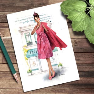 May include: Watercolor illustration of a woman in a pink dress and coat, standing in front of a Tiffany & Co. store. The artwork features a quote and is signed "Grace K."